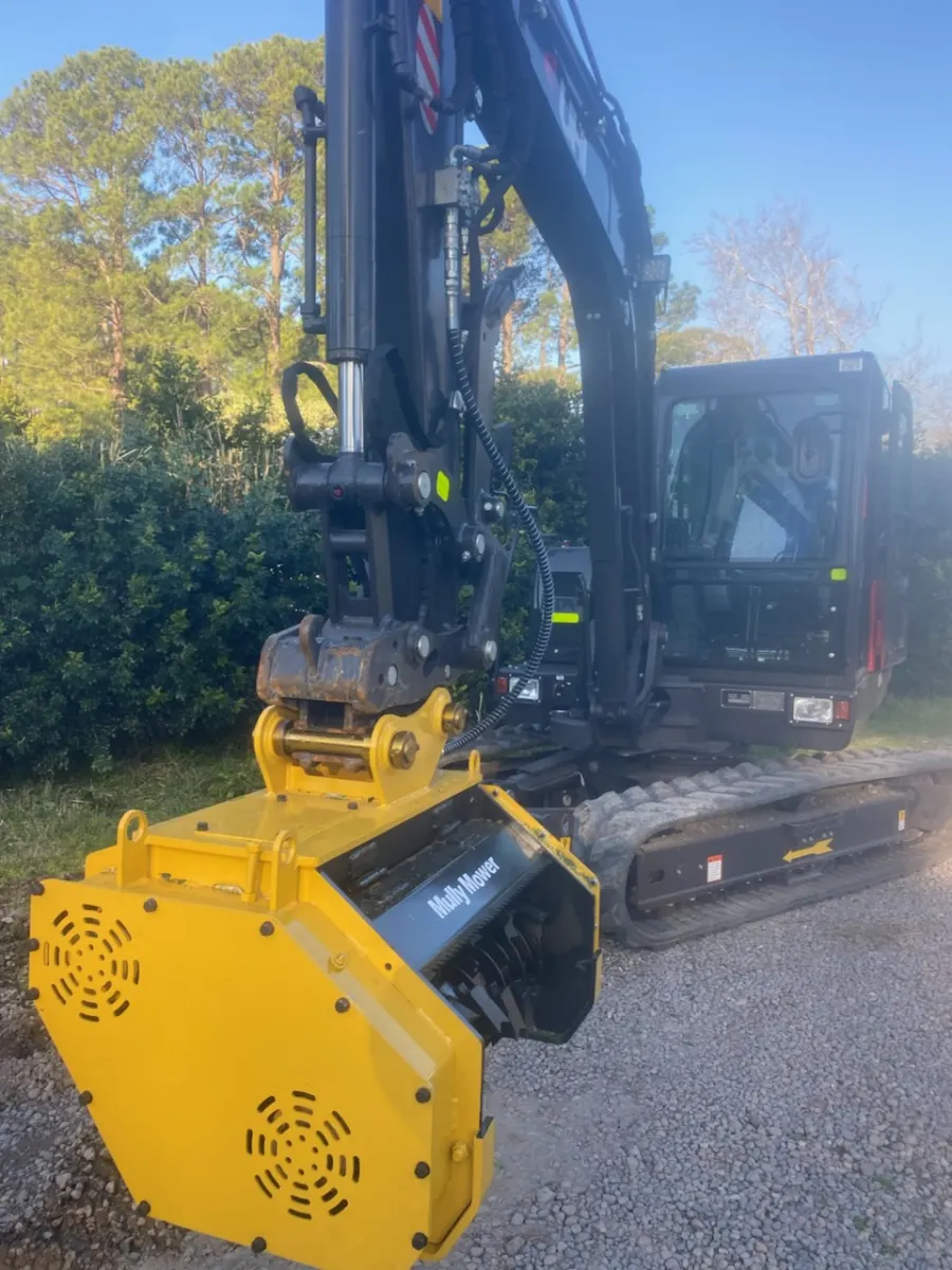 Simon Hull's 6 ton excavator fitted with a yellow Mully Mower flail attachment